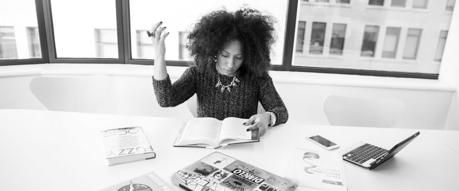 UX Designer diving into books on developing her Leadership Alter Ego