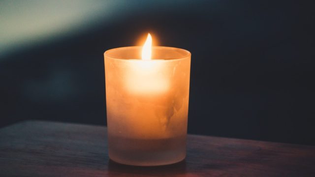 tea light on brown surface
